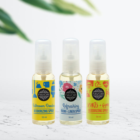 Three bottles of FAVORI Scents Air Spray (50ml) with different scents displayed on a table.