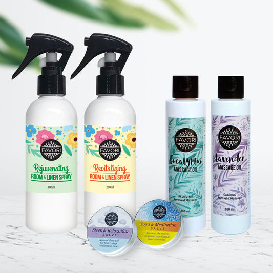A collection of FAVORI Scents aromatherapy products including Air Sprays (200ml), Massage Oils (100ml), and Wellness Salves (15g) displayed against a blurred green and white background.