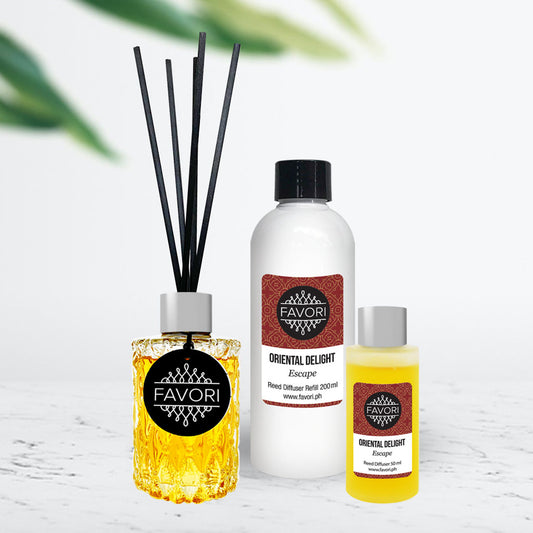 Aromatherapy products including a Trio Reed Diffuser set from FAVORI Scents, room spray, and favori essential oil on a white surface with a plant in the background.