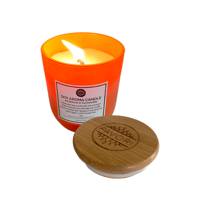A Cranberry Wine Soy Aroma Candle in an orange container with a wooden lid beside it is a FAVORI Scents favorite.