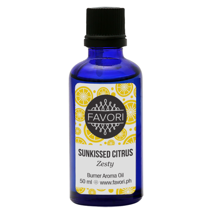 A blue glass bottle of FAVORI Scents Sunkissed Citrus AD Aroma Oil with a zesty label design.