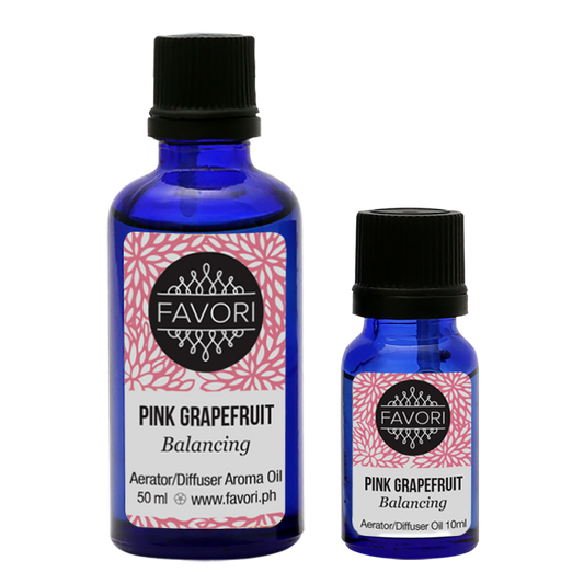 Two bottles of FAVORI Scents Pink Grapefruit Aerator/Diffuser (AD) aroma oil, one large and one small, against a white background.