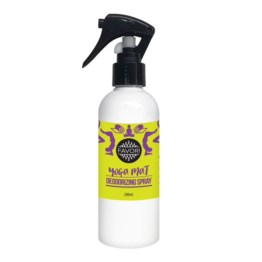 White spray bottle labeled "FAVORI Scents Yoga Mat Deodorizing Air Spray" with a favorite purple and gold label design, infused with essential oils.