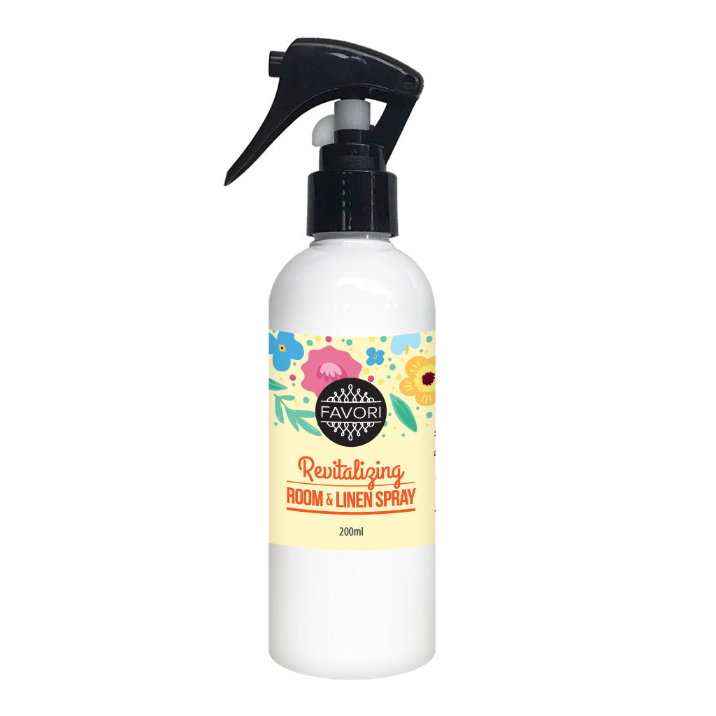 White spray bottle of FAVORI Scents Revitalizing Room & Linen Air Spray (AS) with a floral design, 200ml.