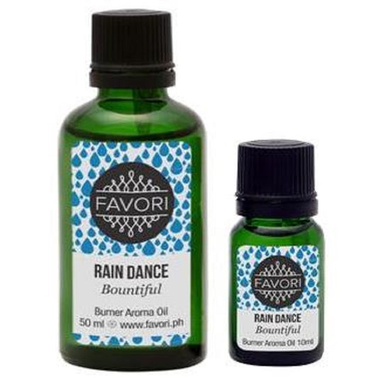 Two bottles of FAVORI Scents Rain Dance Burner Aroma Oil in different sizes.