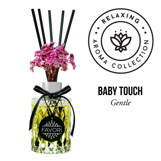 Aromatherapy reed diffuser with a floral scent labeled "Baby Touch Premium" from the FAVORI Scents relaxing aroma oil collection.