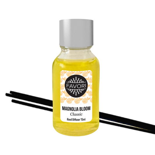 A small bottle of FAVORI Scents Magnolia Bloom Mini Reed Diffuser (MRD) oil with black fiber reed sticks on a white background.