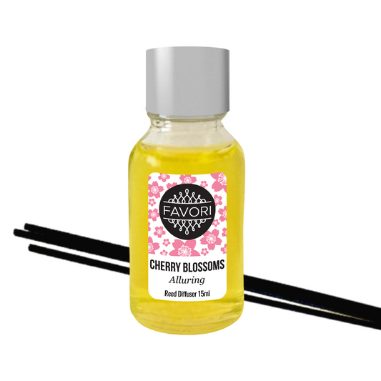A 15ml bottle of FAVORI Scents Cherry Blossoms Mini Reed Diffuser oil with a floral fragrance, accompanied by two black fiber reed sticks.