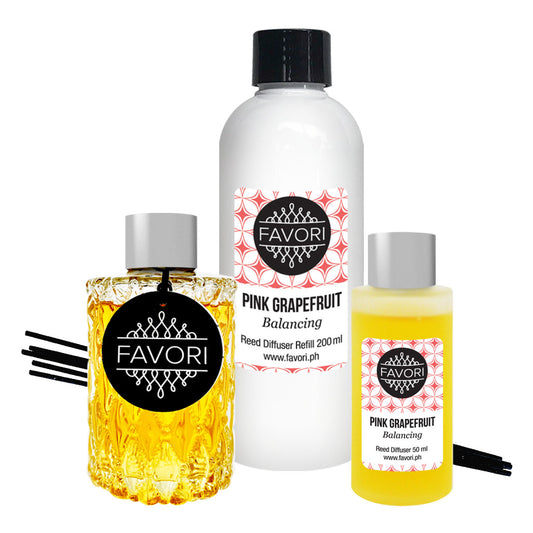 A set of FAVORI Scents Pink Grapefruit Trio Reed Diffuser (TRD) including refill bottles.