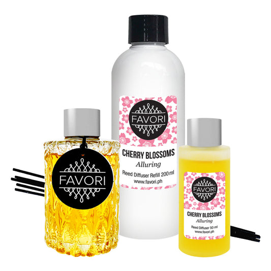A collection of FAVORI Scents Cherry Blossoms TRD products including a reed diffuser, oil refill bottle, and an air purifier spray with a cherry blossoms scent.