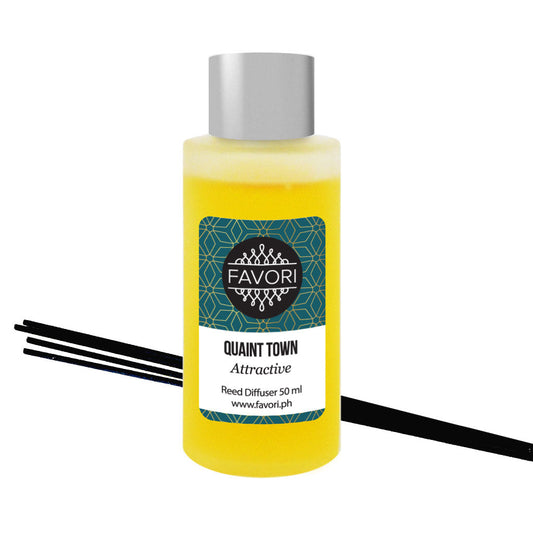 A bottle of FAVORI Scents Quaint Town Regular Reed Diffuser oil labeled 'quaint town' with black reed sticks.
