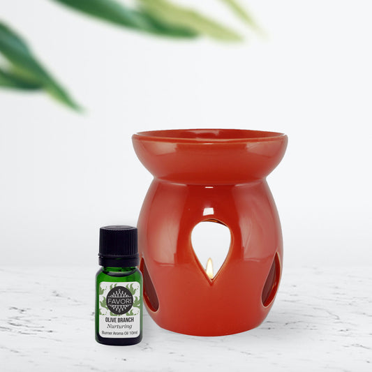 Aromatherapy Raindrop Ceramic Burner Device with FAVORI Scents Olive Branch 10ml Aroma Oil bottle on a white surface with green foliage in the background, exuding an aura of favori.