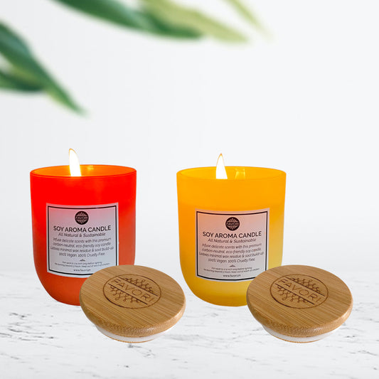 Two FAVORI Scents Soy Aroma Candles (160g) with wooden lids placed in front on a white surface as part of a relaxation pampering gift package and against a blurred background.
