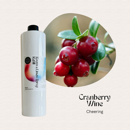 A 500ml FAVORI Scents Refill Air Spray beside cranberries; text reads “Cranberry Wine Cheering” scent.