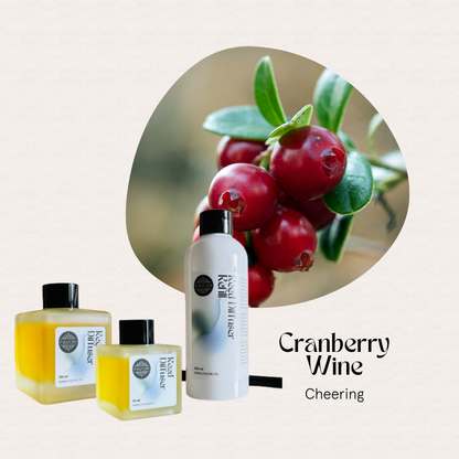 Close-up of cranberries and FAVORI Scents Cranberry Wine Trio Reed Diffuser for long-lasting fragrance.