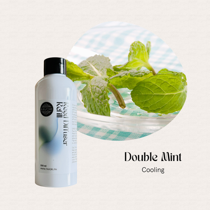 A white Double Mint Reed Diffuser Refill (RDR) by FAVORI Scents beside fresh mint leaves; cooling aroma.