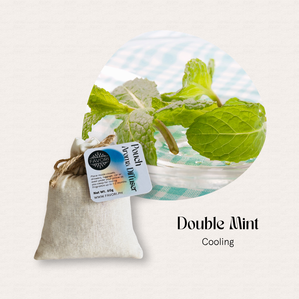 A FAVORI Scents PAD and water-soluble aroma oil beside fresh mint leaves on a checkered cloth.