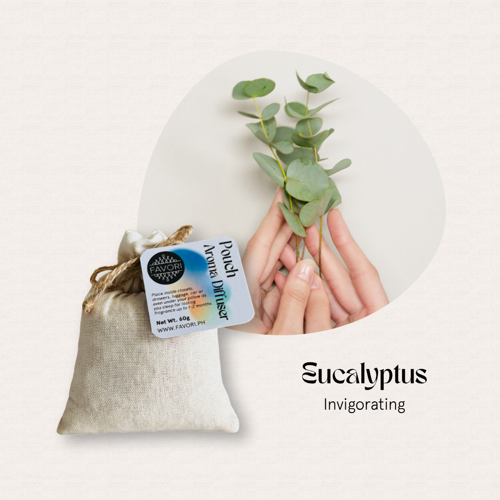 A hand holds eucalyptus leaves over a FAVORI Scents PAD—a perfect pouch aroma diffuser for essential oils.