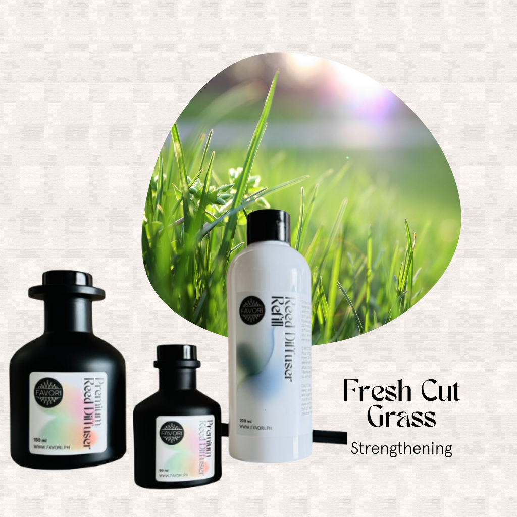 Three FAVORI Scents Fresh Cut Grass Trio Premium Reed Diffusers displayed beside fresh green grass.