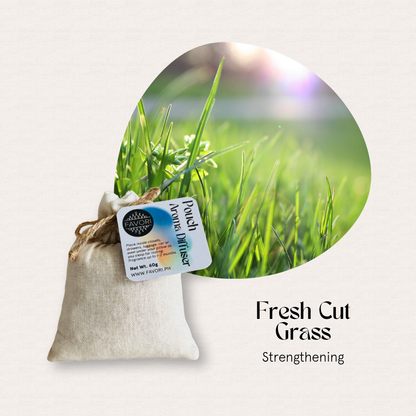 A FAVORI Scents Pouch Aroma Diffuser rests beside bright green grass in the sunlight.