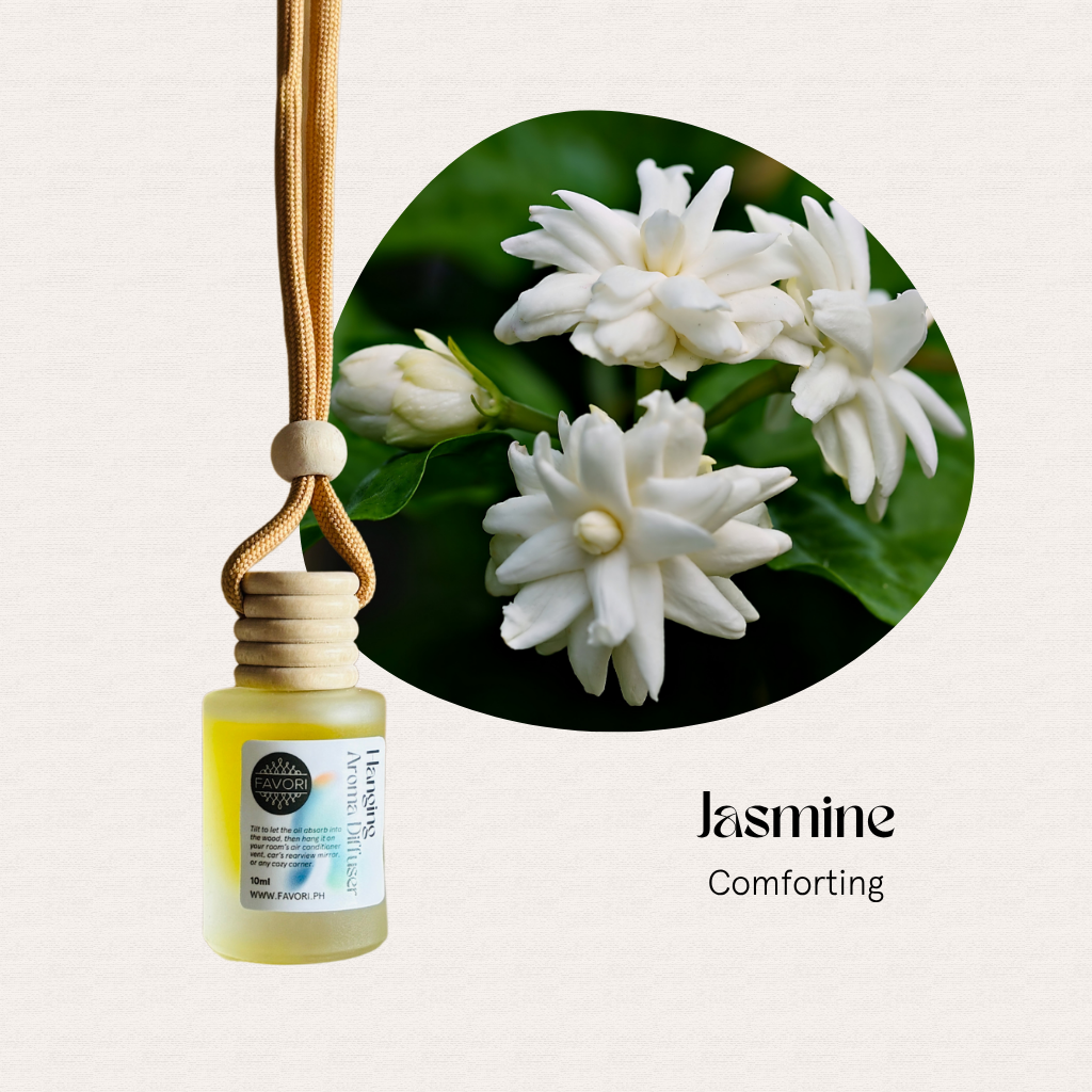 FAVORI Scents Hanging Aroma Diffuser (HAD) with jasmine oil beside blooming jasmine and green leaves.