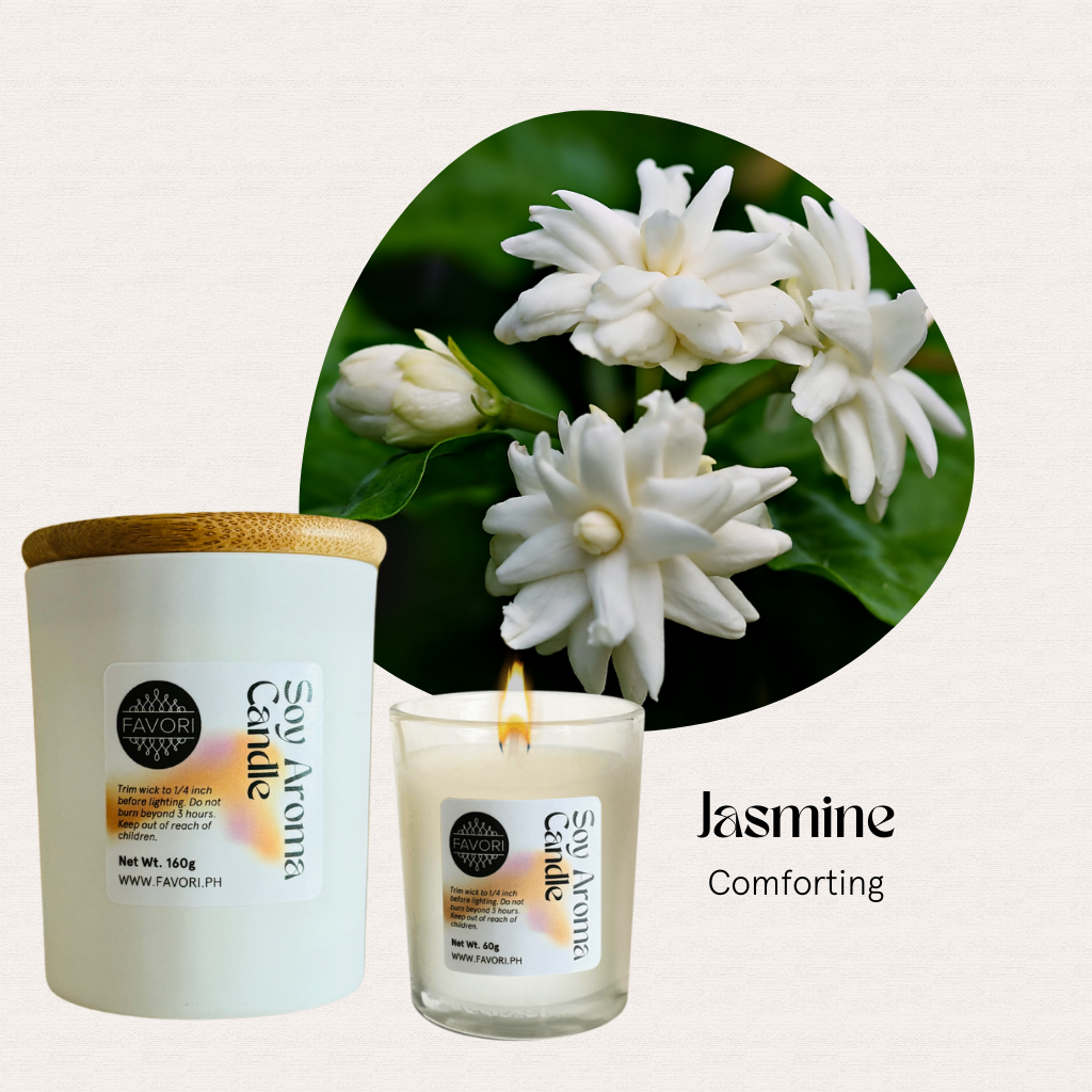 White jasmine flowers above a lit FAVORI Scents All Occasion soy candle in a glass jar.