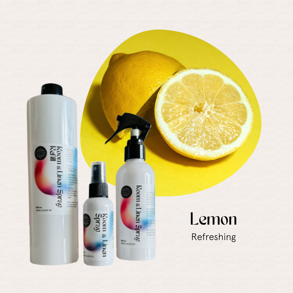 Three FAVORI Scents Trio Air Spray bottles and a lemon half on yellow, text reads: Lemon Refreshing.