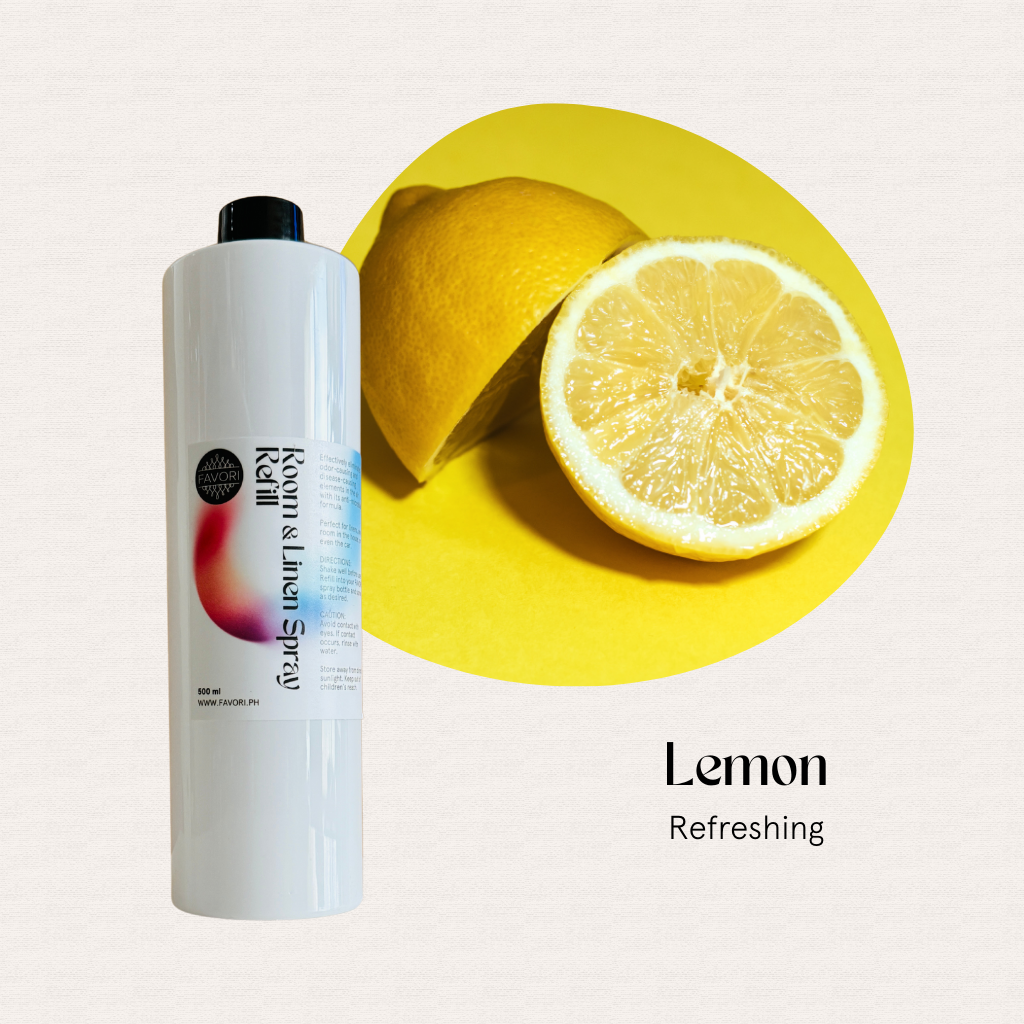 FAVORI Scents Refill – Regular Room & Linen Air Spray 500ml beside a halved lemon, Lemon Refreshing scent.