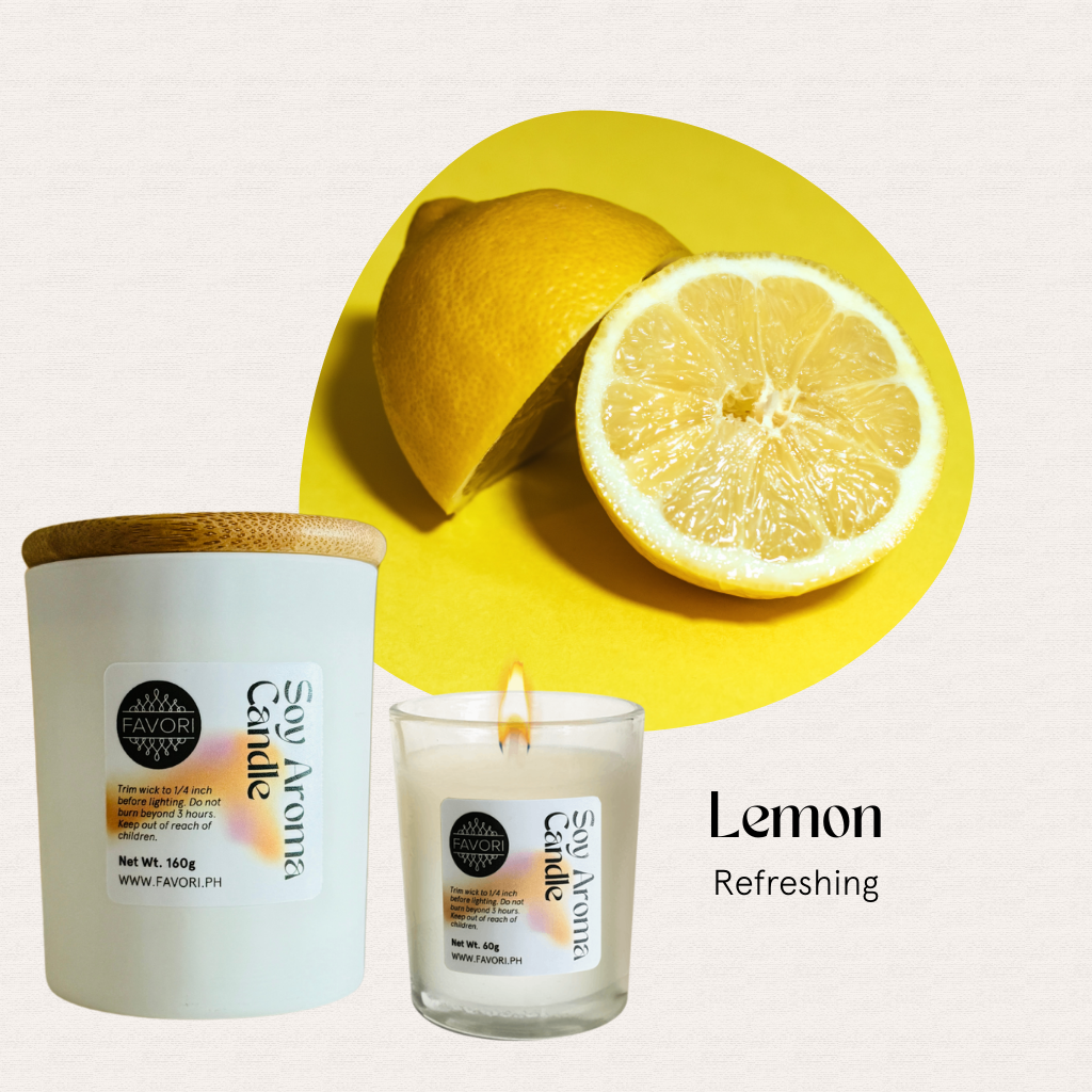 A white premium soy candle by FAVORI Scents, All Occasion, with a wooden lid beside a sliced lemon.