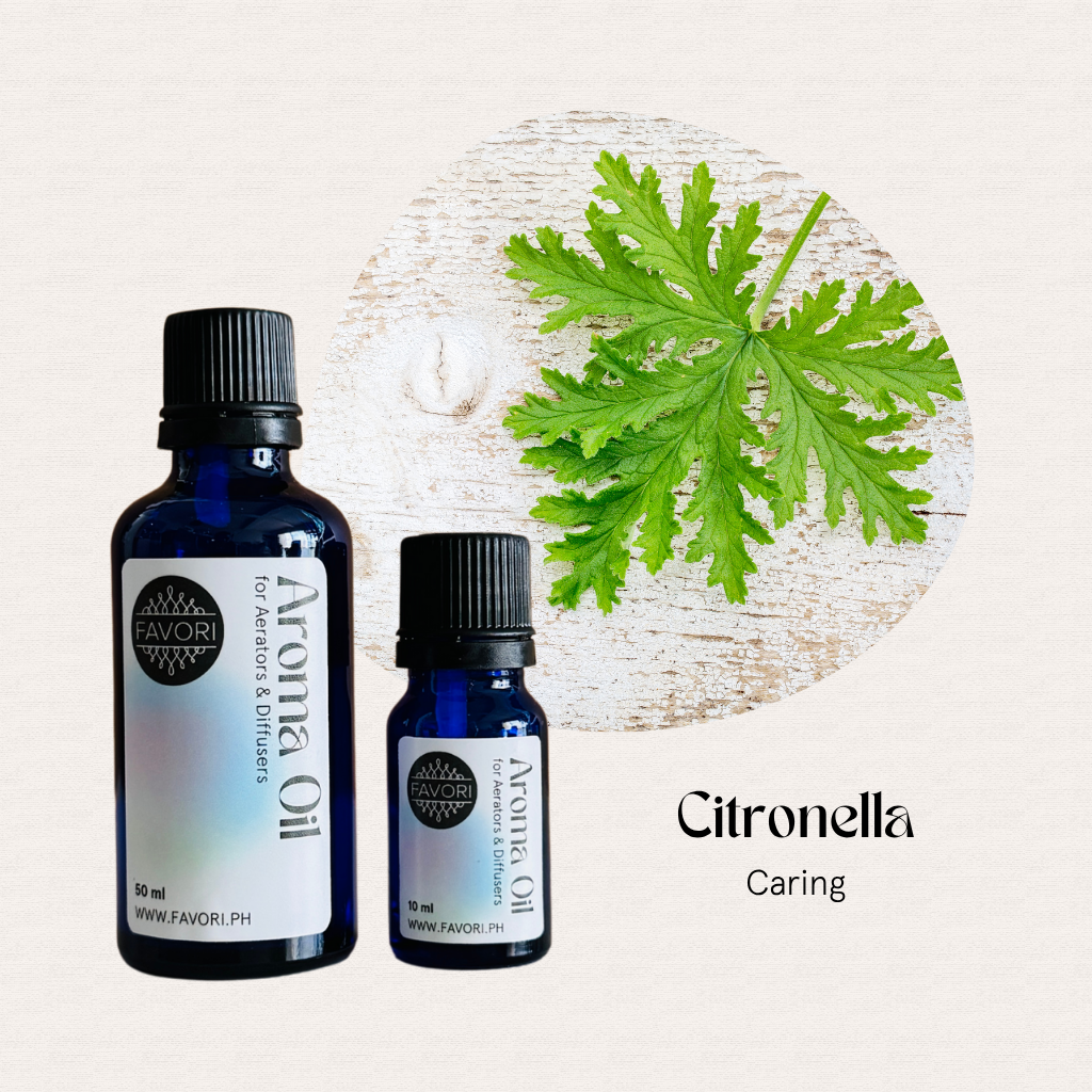 Two blue bottles of FAVORI Scents AD Aroma Oils, citronella scent with green leaf and “Citronella, Caring” text.