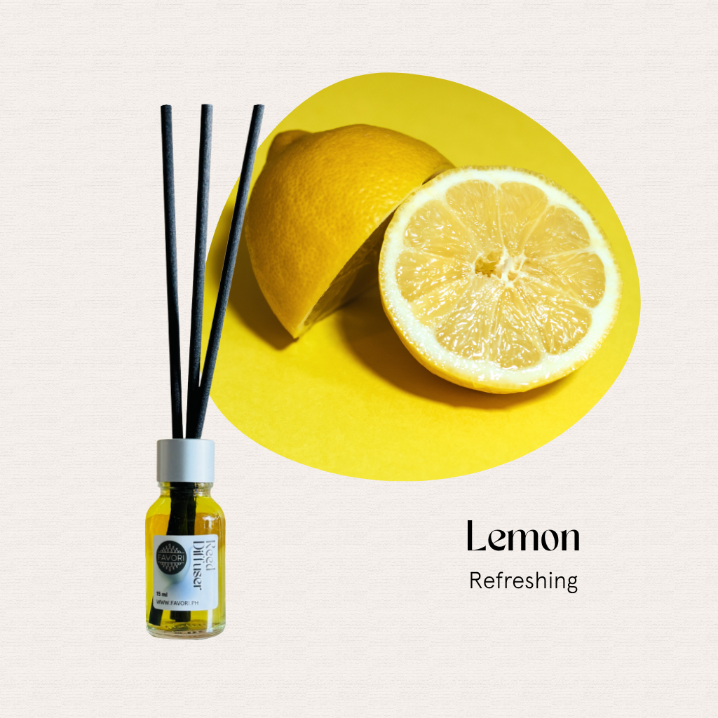 A sliced lemon and FAVORI Scents Mini Reed Diffusers (MRD) with fiber sticks, labeled Lemon Refreshing.