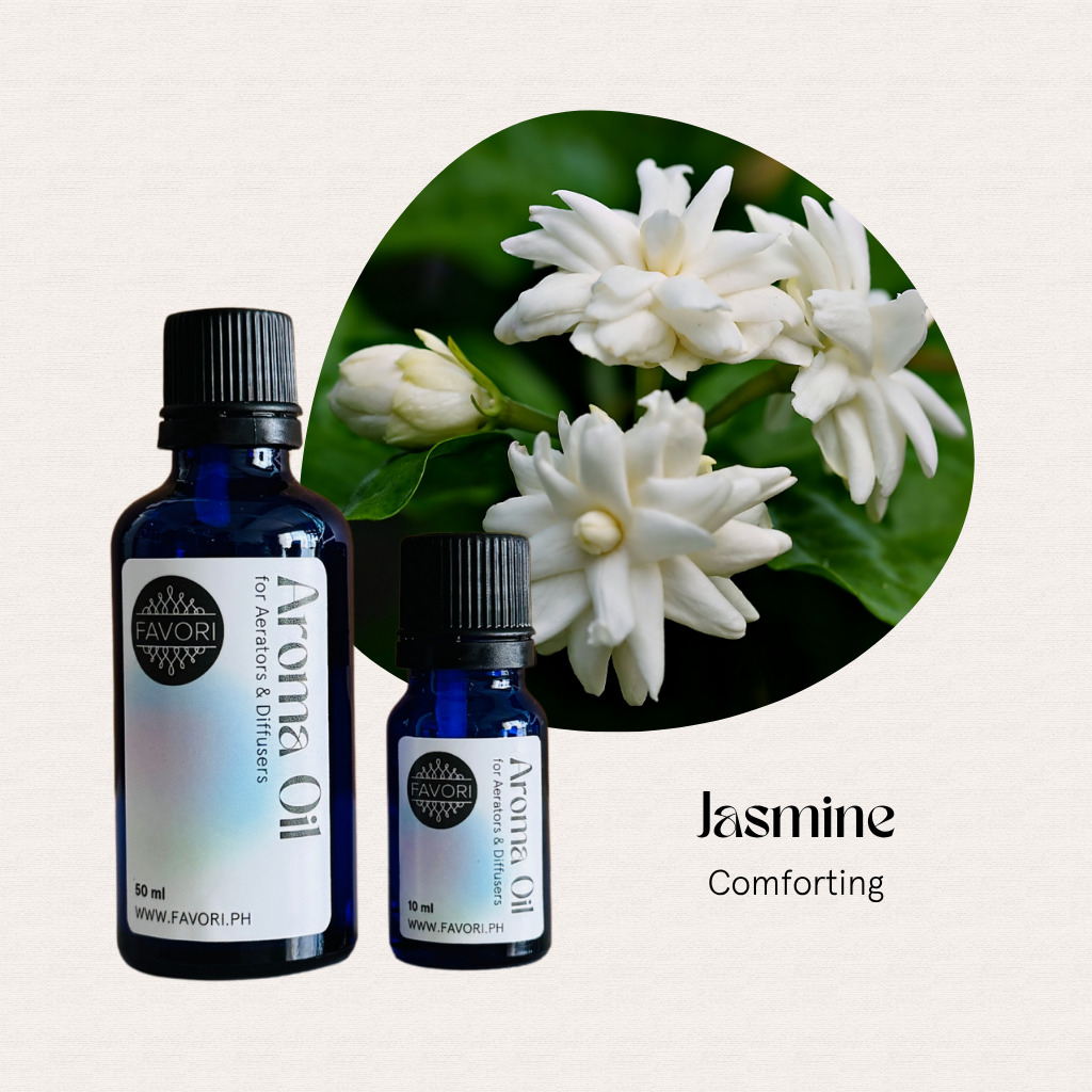 Two blue FAVORI Scents AD Aroma Oil bottles beside jasmine flowers with the text Jasmine Comforting.