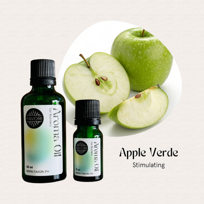 Two bottles of FAVORI Scents Burner Aroma Oils in Apple Verde Stimulating and sliced green apples.
