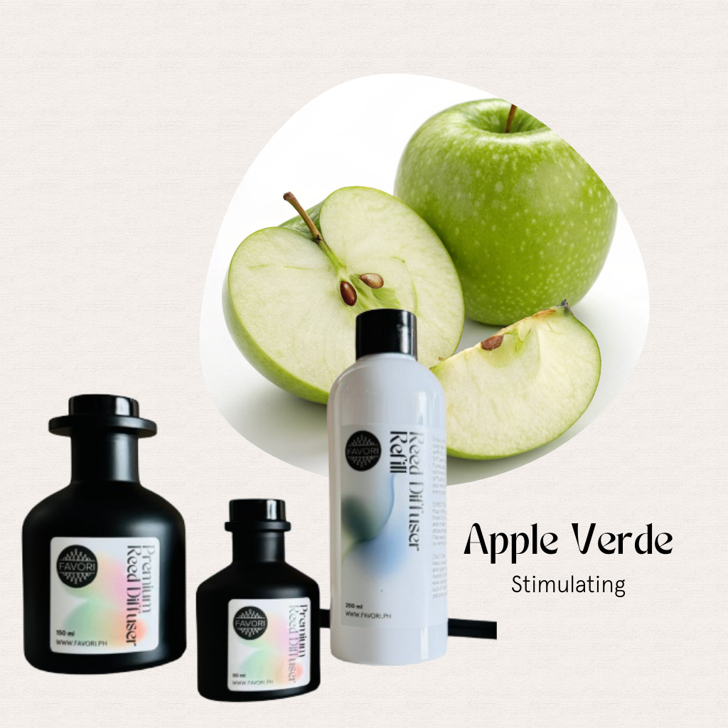 Whole and sliced green apples behind three FAVORI Scents Apple Verde Trio Premium Reed Diffuser bottles.
