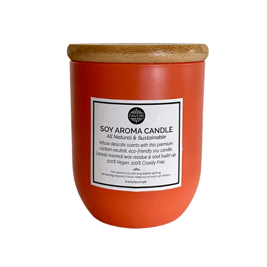 A Cranberry Wine Soy Aroma Candle in a terracotta-colored jar with a wooden lid, infused with FAVORI oil.