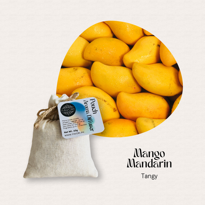 A FAVORI Scents PAD pouch beneath ripe mangoes reads Mango Mandarin, Tangy—ideal with aroma diffuser oil.