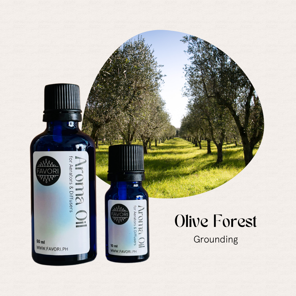 Two blue bottles of FAVORI Scents AD Aroma Oils, Olive Forest scent, with a grounding aroma.