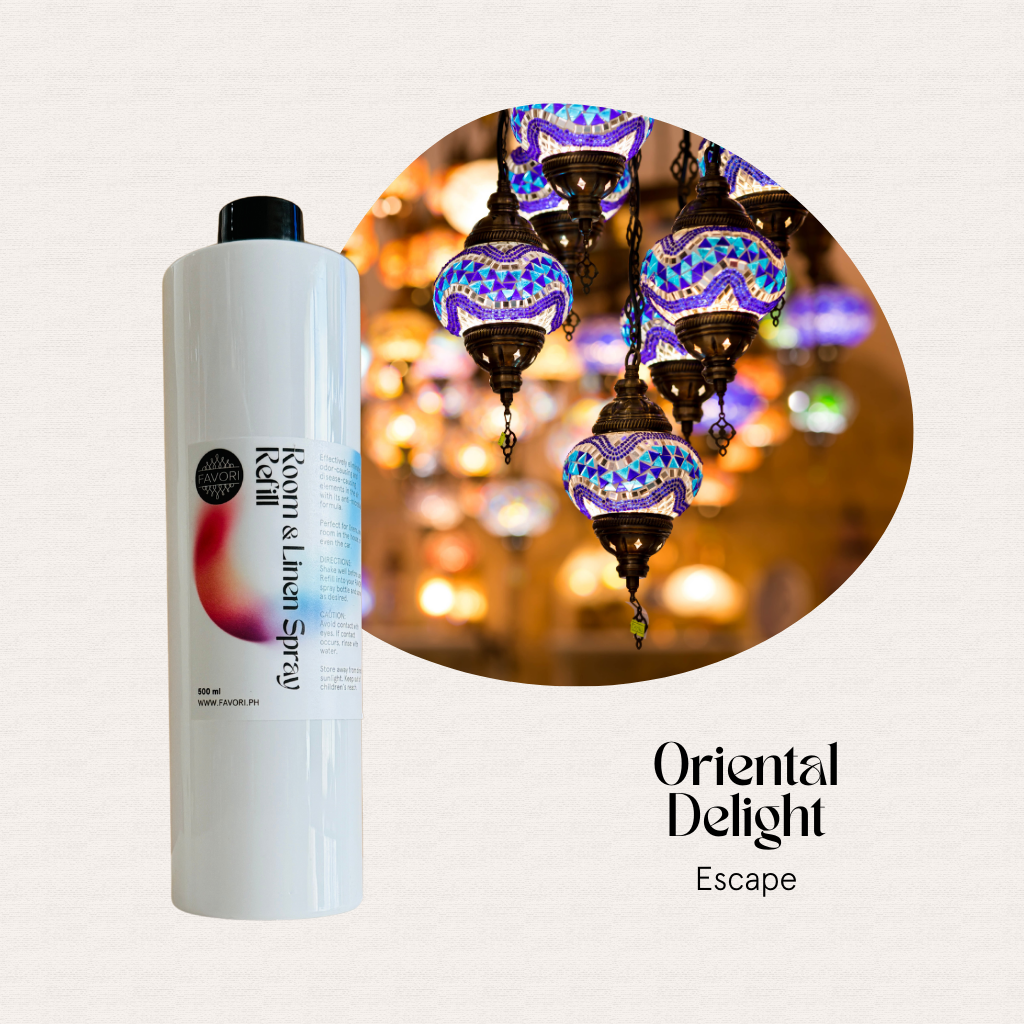 White bottle of FAVORI Scents Refill–Regular Room & Linen Air Spray 500ml beside colorful mosaic lamps.