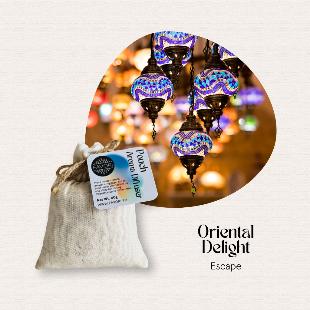 A FAVORI Scents Pouch Aroma Diffuser sits before mosaic lamps, evoking Oriental Delight with aroma oil.