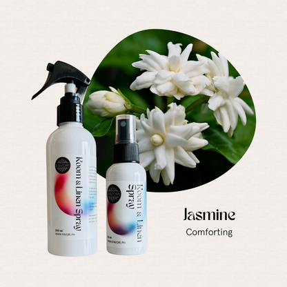 Two FAVORI Scents Regular Air Sprays labeled Jasmine, a comforting mood enhancer, in front of jasmine flowers.
