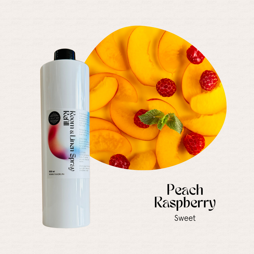 A FAVORI Scents Refill – Regular Room & Linen Air Spray sits beside peach slices, raspberries, and mint.