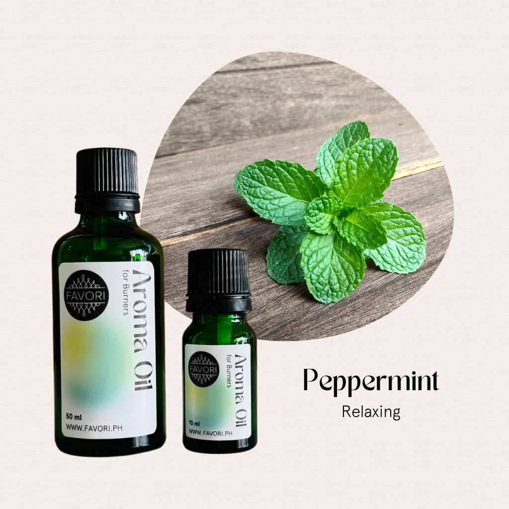 Two bottles of FAVORI Scents Burner (BR) Aroma Oils, Peppermint Relaxing, beside a mint leaf.
