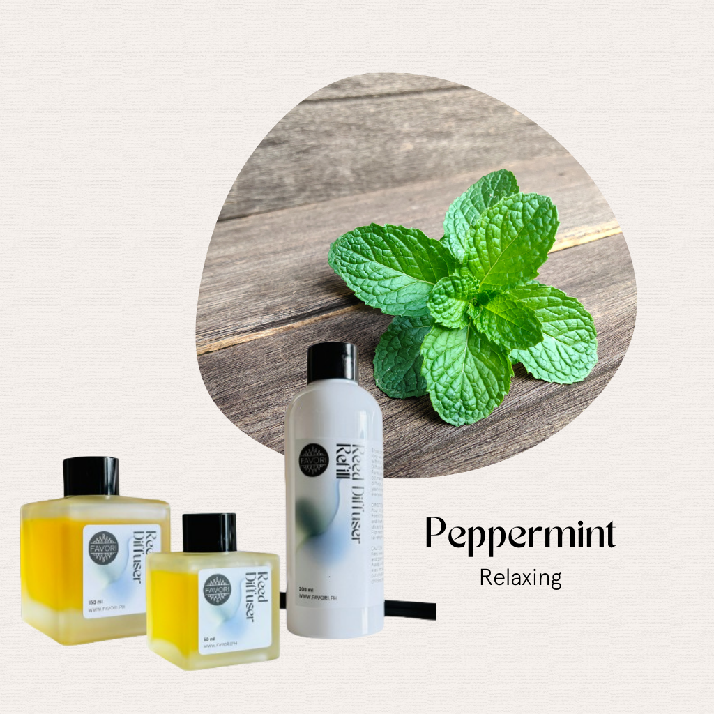 Peppermint leaves with FAVORI Scents Peppermint Trio Reed Diffuser (TRD) on wood, for relaxing aromatherapy.