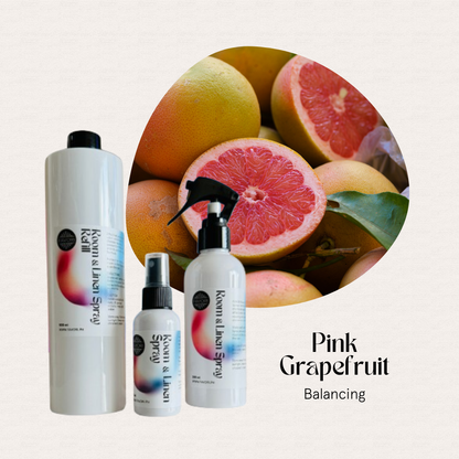 Three FAVORI Scents Trio – Regular Room & Linen Air Sprays with fresh pink grapefruits in the background.