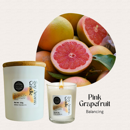 FAVORI Scents All Occasion eco-friendly candles, Pink Grapefruit Balancing, with pink grapefruit halves in front.