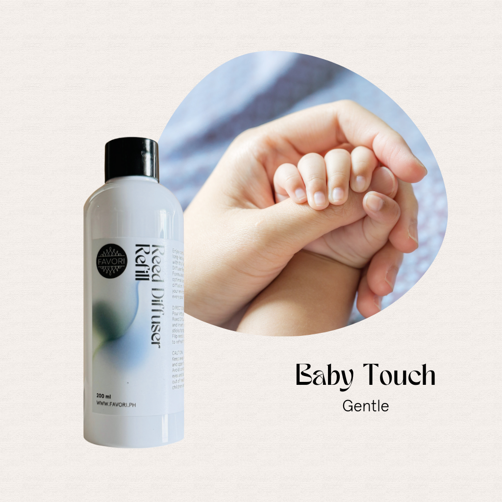 A FAVORI Scents Baby Touch Reed Diffuser Refill beside an adult hand gently holding a babys hand.