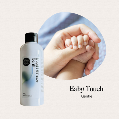 A FAVORI Scents Baby Touch Reed Diffuser Refill beside an adult hand gently holding a babys hand.