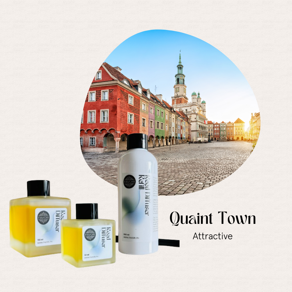 Colorful town square, historic buildings, and FAVORI Scents Quaint Town Trio Reed Diffuser (TRD) displayed.