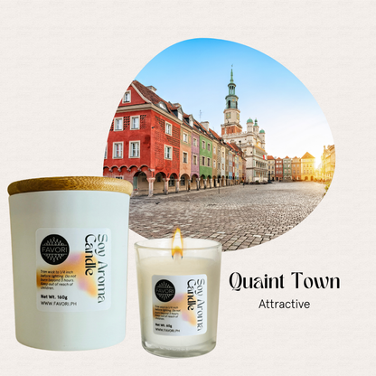 An All Occasion candle by FAVORI Scents glows before colorful old buildings at sunset on a cobblestone square.