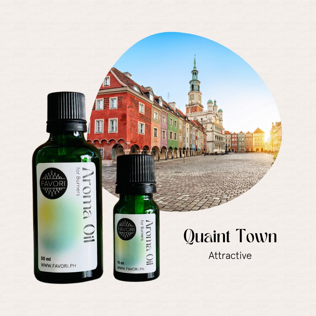 Two green FAVORI Scents Burner Aroma Oils in front of a vibrant European town square with historic buildings.